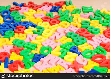 Children letters and digits on the table