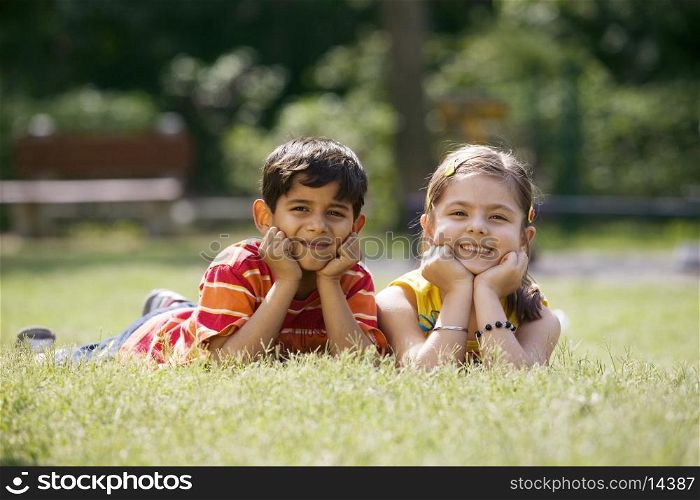 Children lying in a park