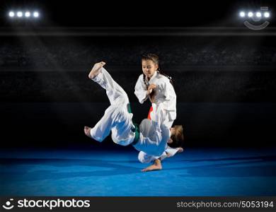 Children martial arts fighters at sports hall