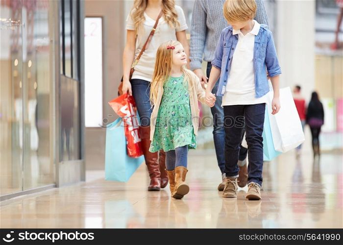 Children On Trip To Shopping Mall With Parents