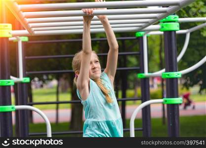 children on vacation - little girl on the playground at the park