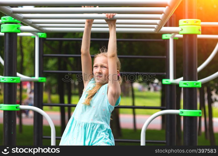 children on vacation - little girl on the playground at the park