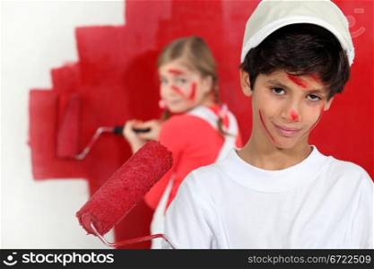 Children painting a room red