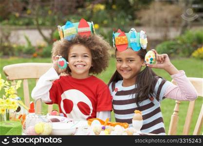 Children Painting Easter Eggs In Gardens
