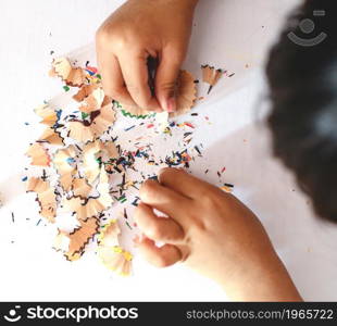 children playing crayons, pencil sharpeners, white background, learning, coloring