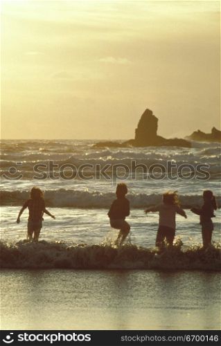 Children Playing in Waves