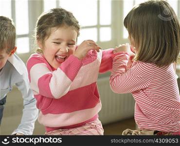 Children playing together indoors