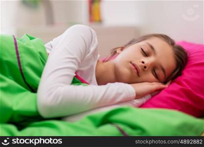 children, rest and people concept - girl sleeping in her bed at home