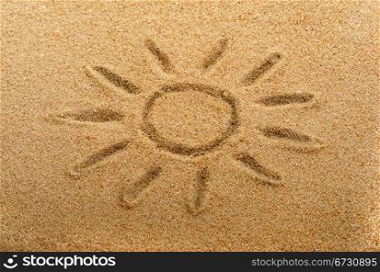 Children&rsquo;s drawing of the sun on sand