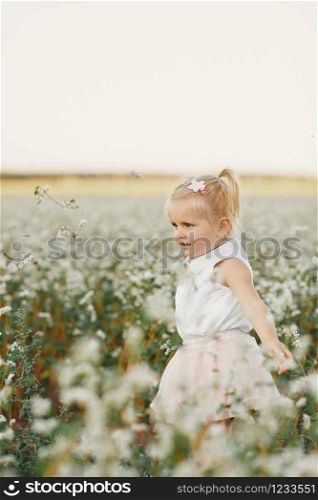 children&rsquo;s portrait of a girl. beautiful girl in a flowering field. Young girl play in spring dandelion field. little girl with two tails. children&rsquo;s portrait of a girl. little girl with two tails. beautiful girl in a flowering field. Young girl play in spring dandelion field