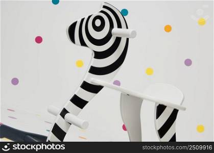 children’s wooden toy zebra swing on white background. children’s wooden toy zebra