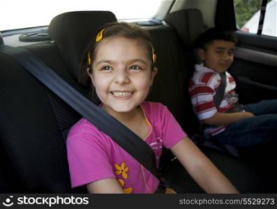 Children sitting inside a car