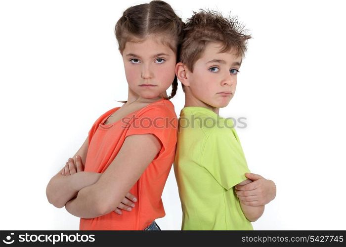 Children standing with arms folded