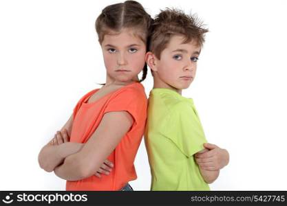 Children standing with arms folded