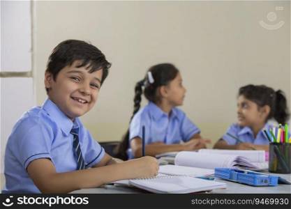  children studying in class and smiling