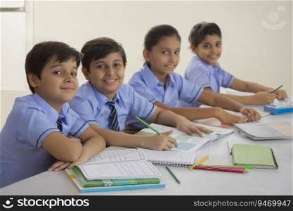 children studying in class and smiling