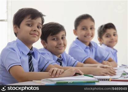 children studying in class and smiling