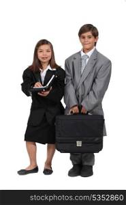 Children wearing business clothes
