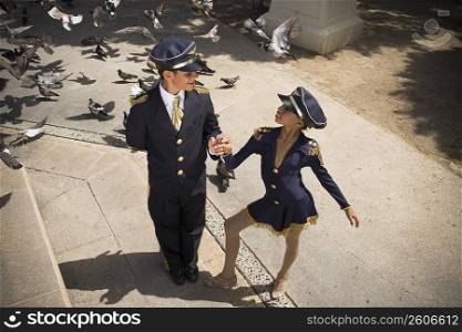 Children wearing pilot and flight attendant costume