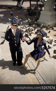 Children wearing pilot and flight attendant costume