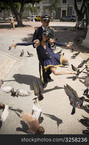 Children wearing pilot and flight attendant costume dancing salsa