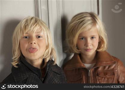 Children wearing winter coats indoors