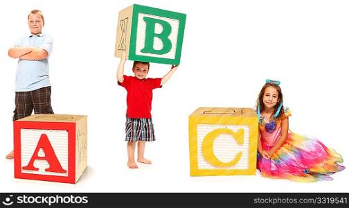 Children with ABC spelled out in colorful alphbet blocks over white.