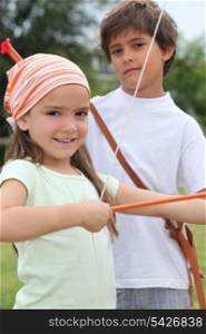 Children with bow and arrow