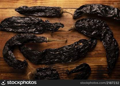 Chile Pasilla. Also known as chile negro or chile prieto. This Mexican chili is the dried form chilaca chili and are used in a variety of Mexican preparations.