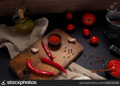 Chile pepper and tomato sauce ingredient for homemade cooking on table. Recipe concept in kitchen