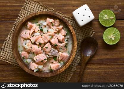 Chilean salmon ceviche prepared with onion, garlic, fresh coriander, salt and lemon juice, photographed overhead with natural light (Selective Focus, Focus on the top of the ceviche)
