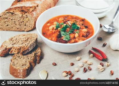 Chili Beans Stew, Bread, Red Chili Pepper And Garlic Ready To Be Served