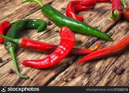 chili hot peppers. Red and green hot peppers on vintage wooden background