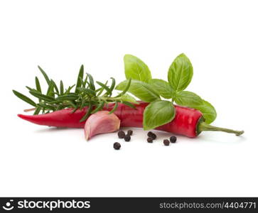 Chili pepper and flavoring herbs isolated on white background