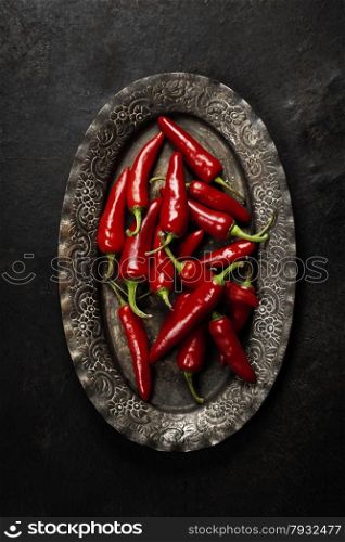 Chili pepper on vintage metal plate