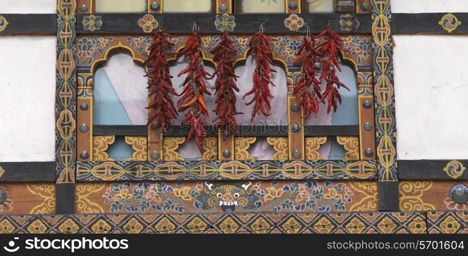 Chili peppers hanging on a window, Paro Town, Paro District, Bhutan
