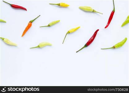 Chili peppers on white background. Copy space