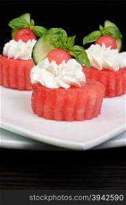 Chilled melon appetizer with ricotta and basil