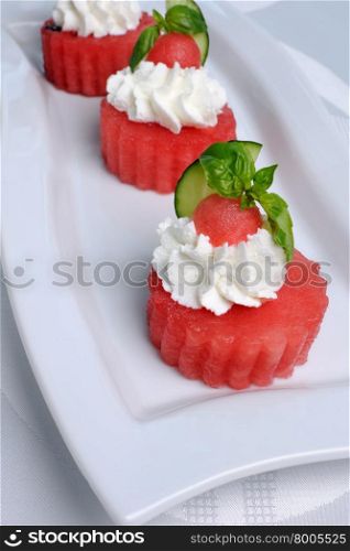 Chilledwatermelon appetizer with ricotta and basil