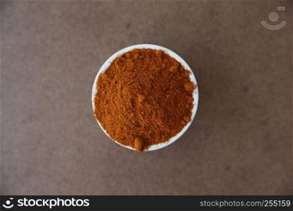 chilli powder on wood background