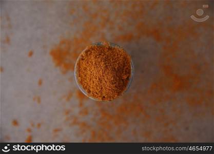chilli powder on wood background