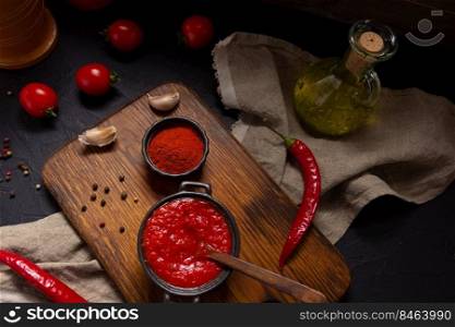 Chilly pepper and tomato sauce ingredient for homemade cooking on tab≤. Chilli and recipe concept in kitchen