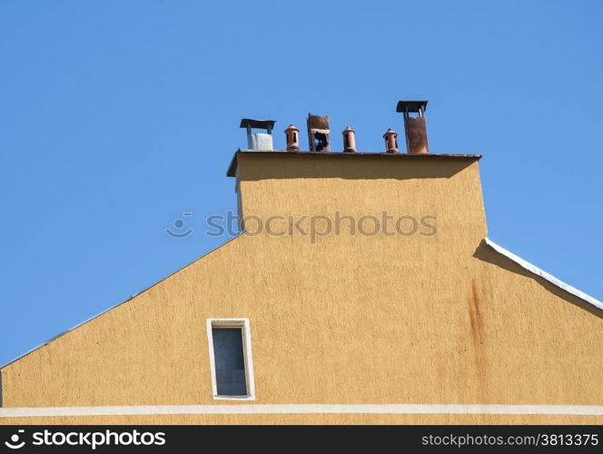 Chimney section of yellow house