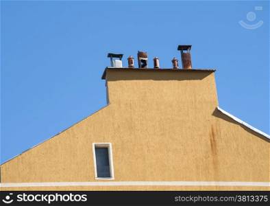 Chimney section of yellow house