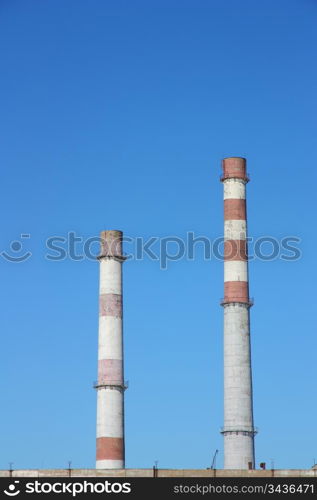 chimneys large plant against the blue sky