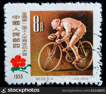 CHINA - CIRCA 1956: A Stamp printed in China shows image of a young cyclist at the First National Workers&rsquo; Sports Games, circa 1956