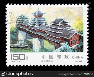 CHINA - CIRCA 1997: A Stamp printed in China shows a traditional covered bridge, circa 1997