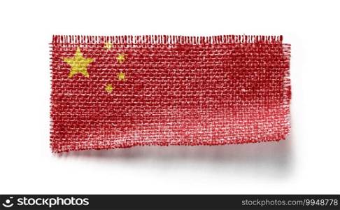 China flag on a piece of cloth on a white background.. China flag on a piece of cloth on a white background