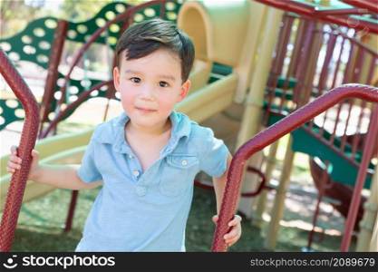 Chinese and Caucasian Boy Having Fun At The Playground.