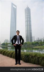 Chinese businessman near skyscrapers